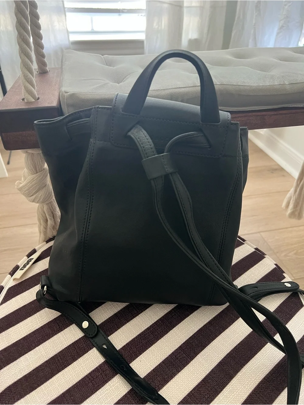 Longchamp Black Backpack with Red and White Lettering Appliqué
